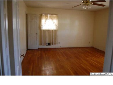 Large master bedroom with original hardwoods throu
