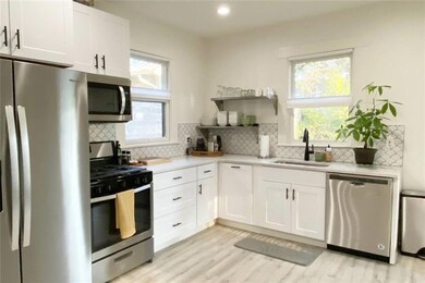 Kitchen with a sink, stainless steel appliances, 