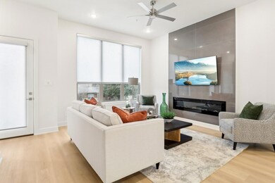 Living area with light wood-type flooring, baseboa