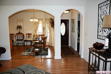 Entry with view into dining/kitchen leads to bedro