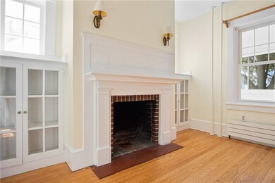 Original sconces above the fireplace.