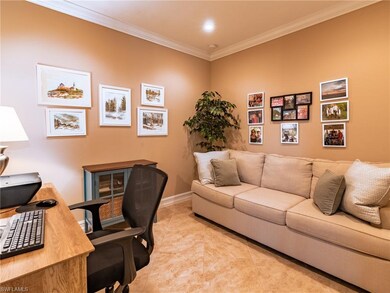 Conveniently located off the main living area, the den is currently being used as an office and sitting area.