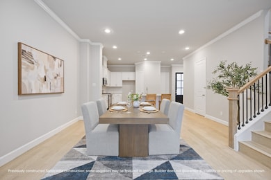 The dining space connects effortlessly to the kitc