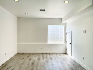 Living Area Off Kitchen w/ Glass Wall for Privacy & Natural Light