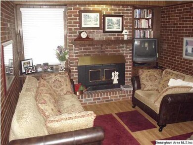 DEN OFF KITCHEN HAS A WOOD BURNING FIREPLACE