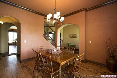 Formal Dining Room with hardwood floors, chandelie