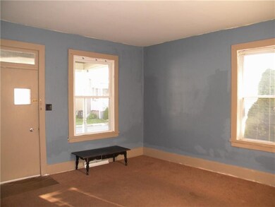 Living room with some updated windows and entry do