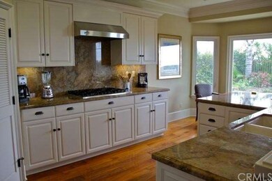 Gorgeous kitchen with granite counters and top-of-