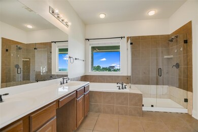 Bathroom featuring a shower stall, tile patterned