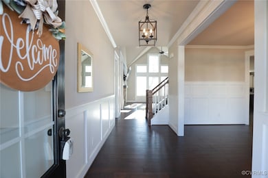 Foyer featuring notable chandelier, ornamental mol