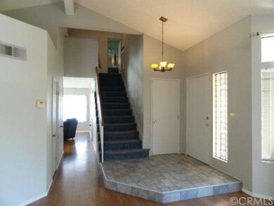 Entry with Custom Tile and Wood Laminate Flooring