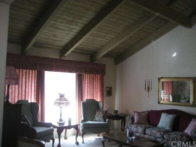 LIVING ROOM WITH NATURAL WOOD BEAM CATHEDRAL CEILI