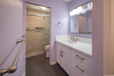 Updated primary bath with large vanity. Walk-in sh