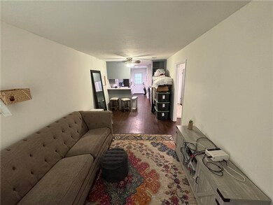 Living area with dark wood finished floors and cei