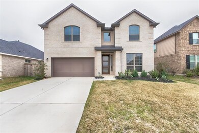 The 2 car garage and double-wide concrete driveway provides plenty of space for your vehicles. Notice the large windows on the front of the home- these provide nice natural lighting within the home.