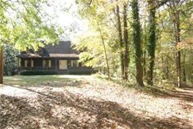 Simple Country Home sitting on 15 acres with a pon