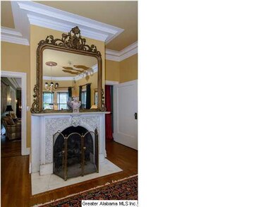 Another view of the carved-mantle below the gold-l
