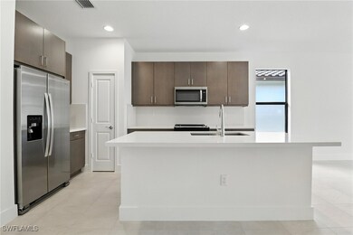 Kitchen featuring appliances with stainless steel