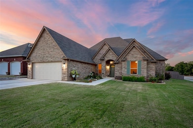 French provincial home featuring driveway, roof wi