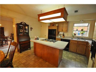Second view of the kitchen highlights the entry in