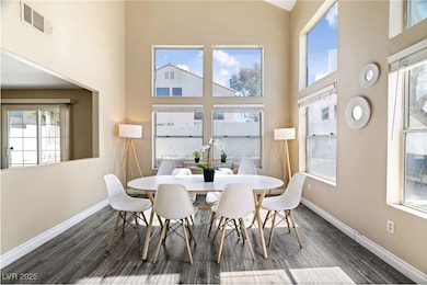 Dining area featuring wood finished floors, basebo