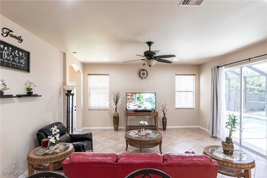 Living room with light tile patterned floors, plen