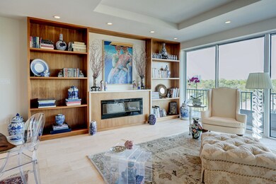 Anchored by a fireplace with custom built-ins, the