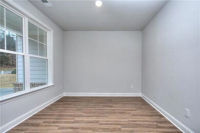 Flex room featuring wood-style finished floors, baseboards, and recessed lighting
