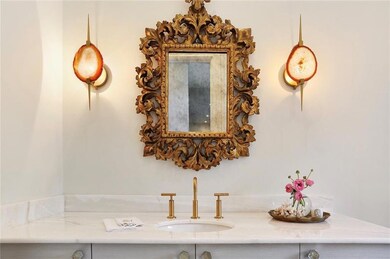 Magazine worthy powder room off foyer.