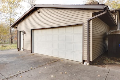 Garage featuring driveway
