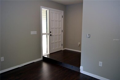 Sunken L shaped living-dining room with new Laminate flooring.