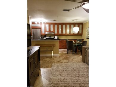 Open kitchen area with plenty of cabinetry.   This