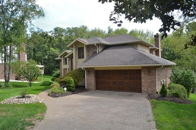 The stone driveway creates a lovely entrance to th