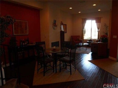 View of Great Room from kitchen. Red wall has been