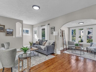 Living room with light hardwood flooring, a health