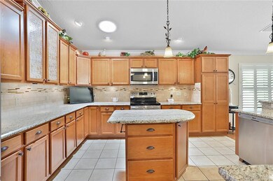 Kitchen with tile flooring and plenty of cabinet s