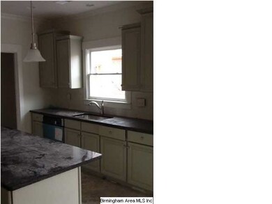 Painted cabinets with black granite make you think