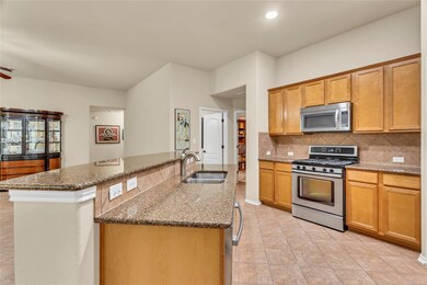 Kitchen featuring appliances with stainless steel