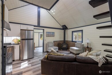 The wood stove is placed in the heart of the house providing warmth and ambiance throughout the winter.