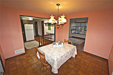 Dining open to kitchen...durable ceramic floor...p