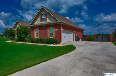 Featuring concrete driveway.