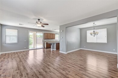 Unfurnished living room featuring wood finished fl