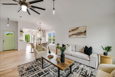 Living area with light wood finished floors, loft