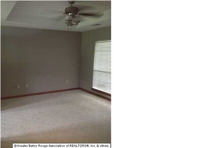 living room with recessed ceiling