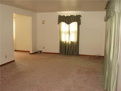 Living Room. 13x22 - Window treatments stay.