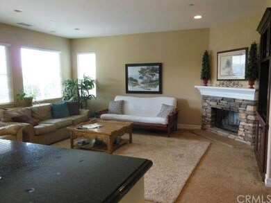 VIEW FROM KITCHEN LOOKING INTO FAMILY ROOM.