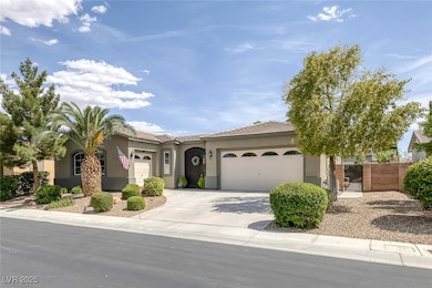 View of front of house featuring a garage, stucco