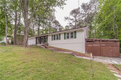 Ranch-style home with brick siding and a front yar