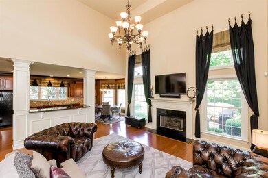 Elegant two story ceiling in the living room with gas fireplace makes this a great gathering spot for your family.