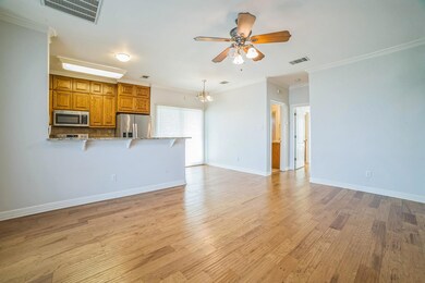 Unfurnished living room featuring a ceiling fan, 